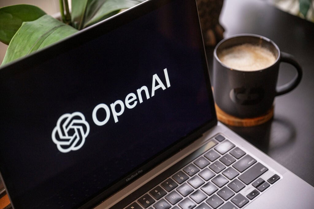 The Open AI logo on a laptop
